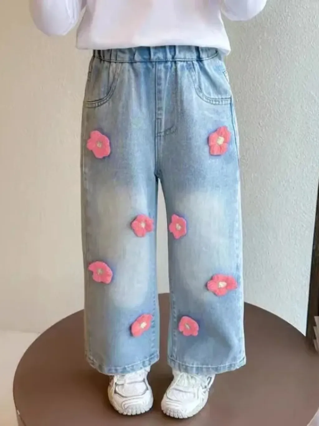 Girls' Blue Jeans with Floral Pattern — a pair designed to be worn everywhere