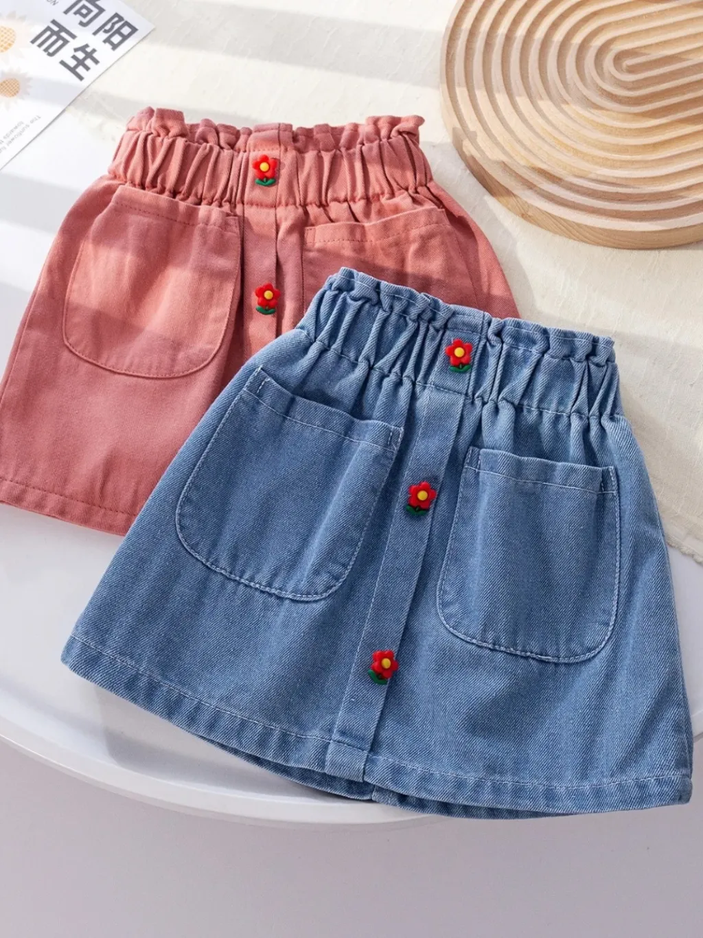 Girls' Denim Skirt with Elasticated Waist and Flower Buttons — a pair designed to be worn everywhere