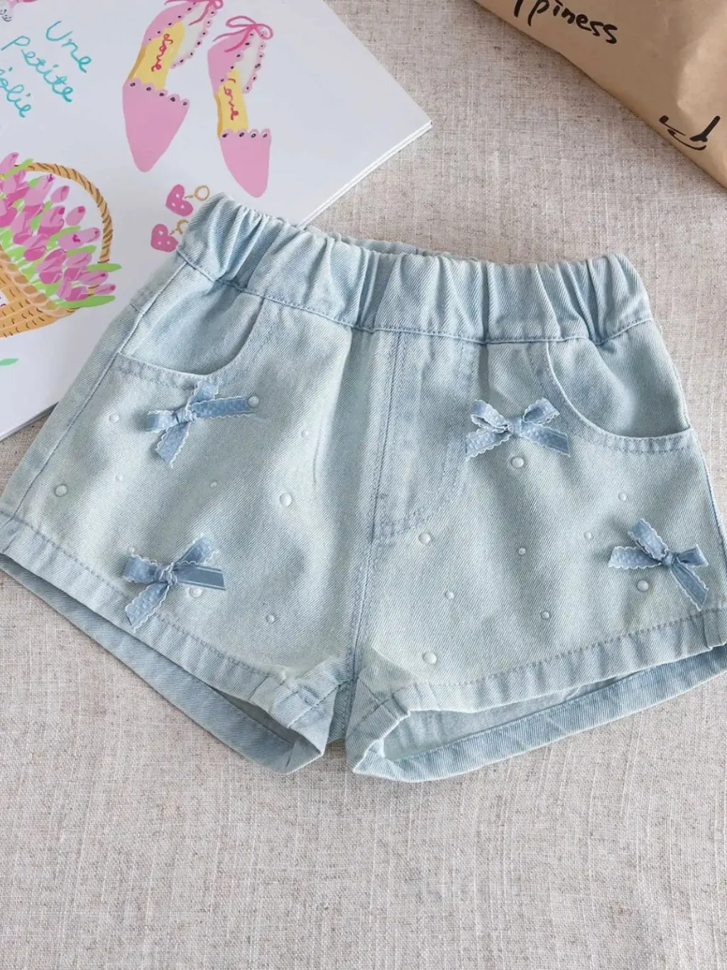 Girls' Light Blue Denim Shorts with Bows and Beads — a pair designed to be worn everywhere