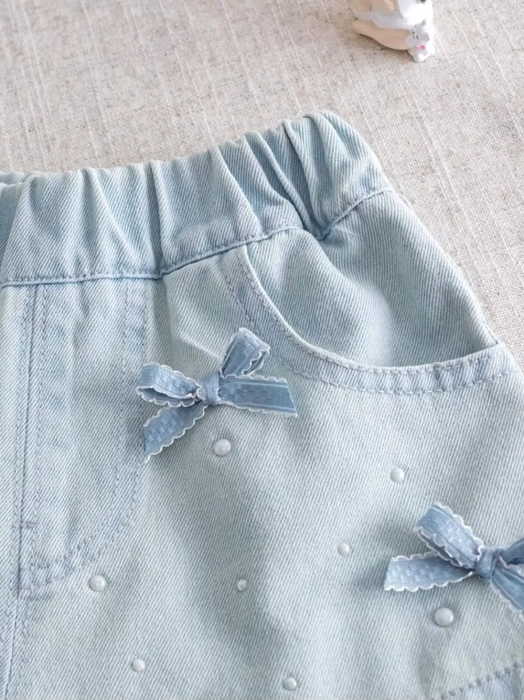 Girls' Light Blue Denim Shorts with Bows and Beads — endless ways to style it