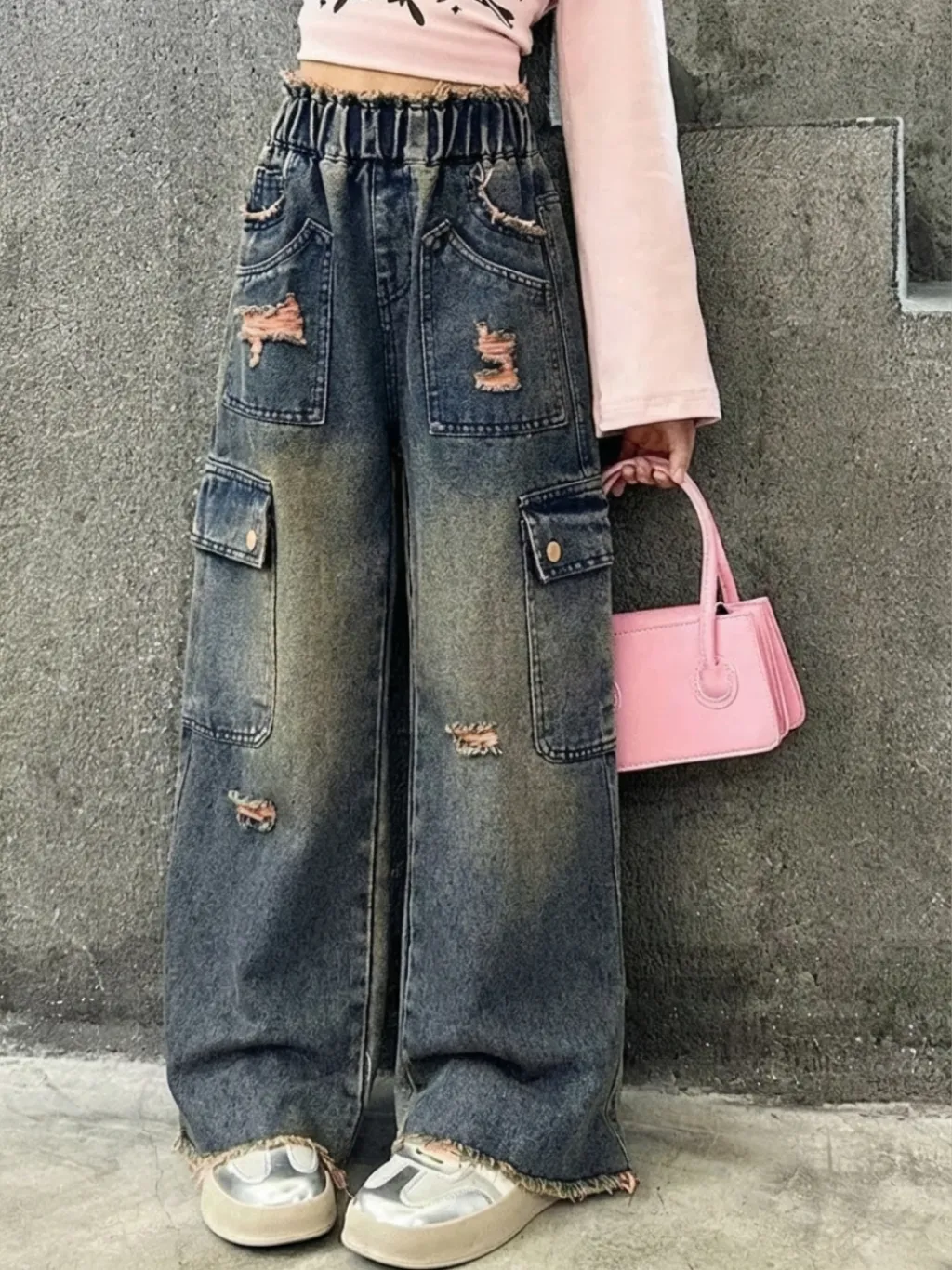 Girls' Washed Blue Distressed Cargo Jeans in Pink — a pair designed to be worn everywhere
