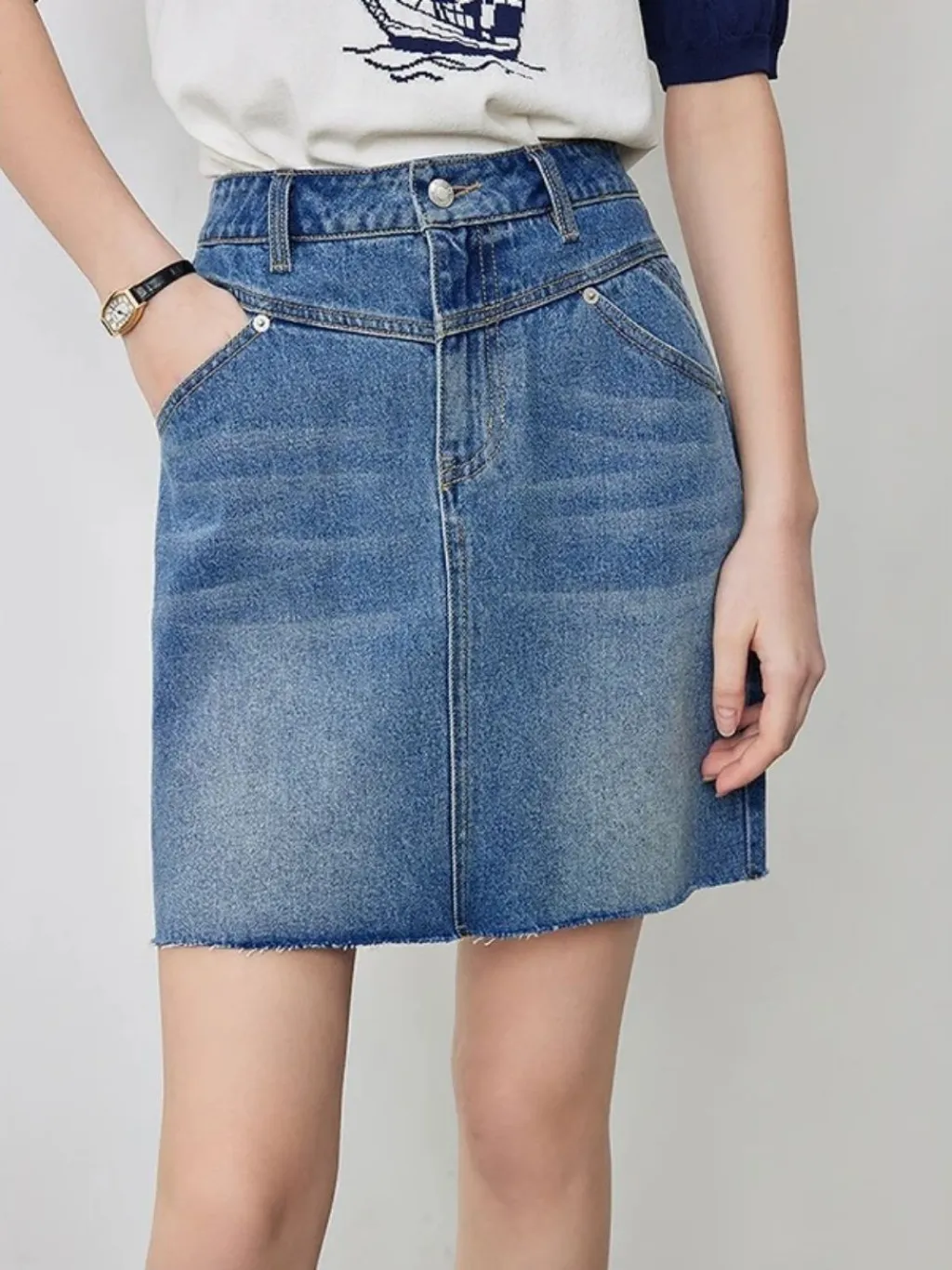 Short Washed Blue Denim Skirt with Graphic Seams — a pair designed to be worn everywhere