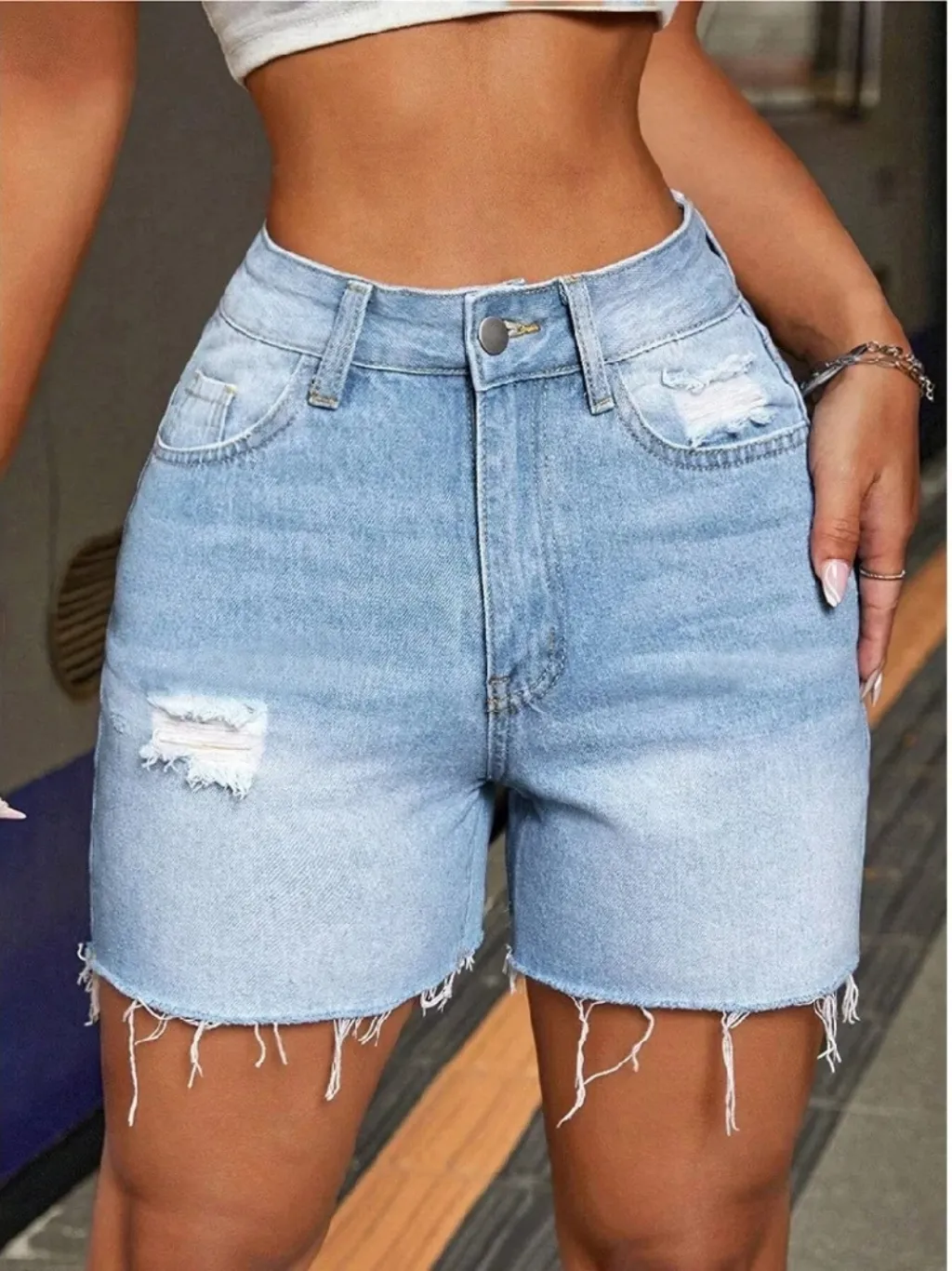Women's Light Blue Distressed Denim Shorts — a pair designed to be worn everywhere