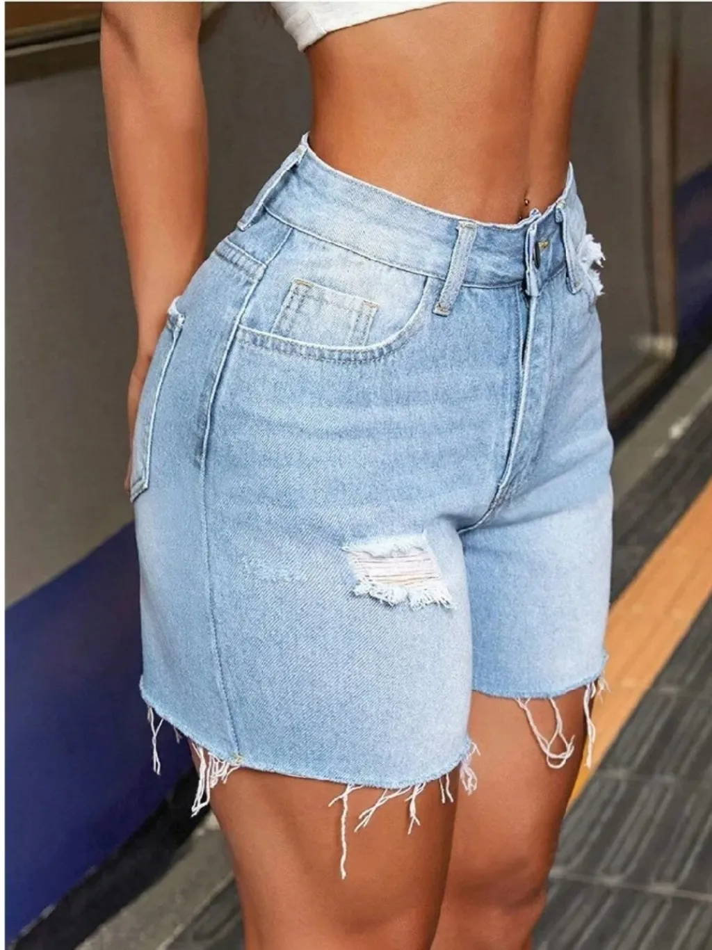 Women's Light Blue Distressed Denim Shorts — endless ways to style it